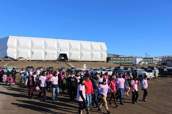 Pink is the colour as runners, seen here in front of Nakasuk Elementary School in Iqaluit, prepare to participate in the CIBC Run for the Cure to fundraise for breast cancer research on Oct. 9. The event, which was postponed by a week due to a blizzard Sept. 30, raised more than $2,600. (PHOTO/FACEBOOK) 
