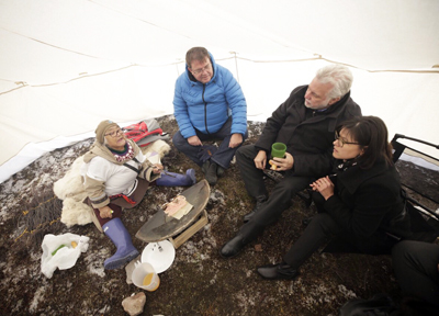Quebec Premier Philippe Couillard stops for tea and bannock in a canvas tent set up at Tursujuq park Oct. 27. Couillard is pictured with KRG chair Jennifer Munick, Ungava MNA Jean Boucher and elder Viola Napartuk. (PHOTO COURTESY OF GOV. OF QUEBEC)