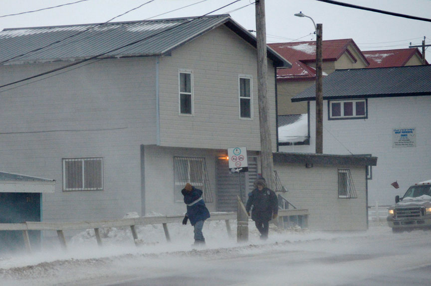 The City of Iqaluit suspended services Nov. 20 when high winds and blowing snow began to batter the community around noon that day. Environment Canada has issued wind warnings across Nunavut's Qikiqtani region. Winds from the east are forecast to remain at sustained speeds of 70 km/h or more in the Iqaluit area, with gusts as strong as 110 km/h, and temperatures around -1 C, this afternoon. Periods of flurries, expected to continue until Tuesday, will contribute to low visibility and dangerous snow drifts. For Tuesday, Environment Canada forecasts periods of rain or snow and 60 km/h winds gusting to 80 km/h with temperatures ranging from 3 C to -2 C. (PHOTO BY STEVE DUCHARME)