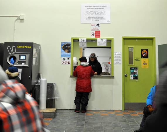 Co-op customers in Puvirnituq first pay for and then pick up their alcohol order at this counter in the lobby of the co-op store. The community has been selling beer and wine since 2015. (PHOTO BY SARAH ROGERS)