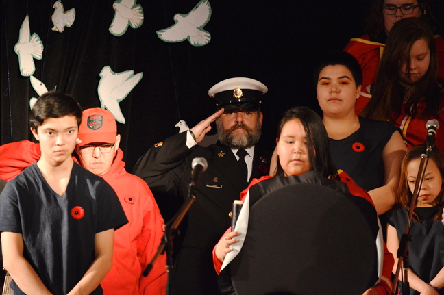 High school students in Iqaluit honoured Canada's soldiers and veterans early this year on Nov. 9, two days ahead of official Remembrance Day ceremonies across the country this Saturday. Attendance was high during the afternoon ceremony at Inuksuk High School, with many Iqalungmiut taking time during their lunch break to see the student-run event which featured a collection of songs, poetry and wreath laying. Iqaluit's official Remembrance Day ceremony is scheduled to begin at the Cadet Hall at 10:30 a.m., Nov. 11, with the program continuing until 1 p.m. The City of Iqaluit is reminding residents that city offices will be closed on Nov. 13 for the Remembrance Day civic holiday. Trucked services on that day will be restricted, although emergency call-outs can be requested, for a $250 fee, at the city's dispatch: 979-5650. See more photos from the Inuksuk ceremony on our Facebook Page. (PHOTO BY STEVE DUCHARME)