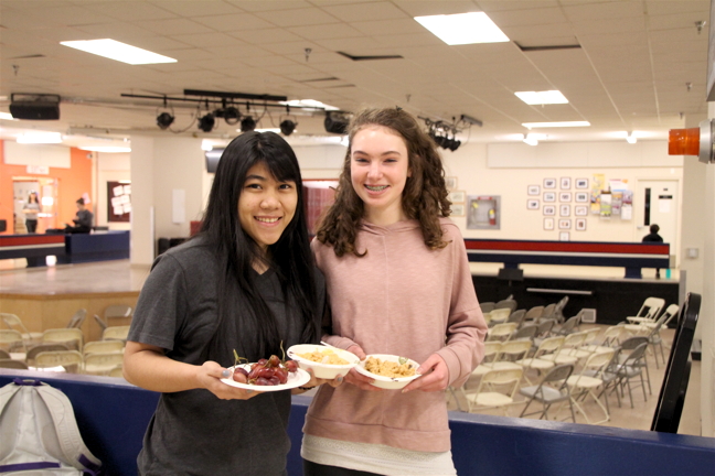 Grade 12 student Marjorie Casiong and Grade 9 student Claire Hooey of Iqaluit are all set to enjoy their free lunch of homemade wholewheat mac-and-cheese.