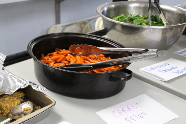 These carrot fries were a hit at Inuksuk High School’s free-lunch day. School volunteers and students in the food studies program now prepare food for the new program, but soon this role will be taken over, in part, by six part-time staff hired from among the student body.