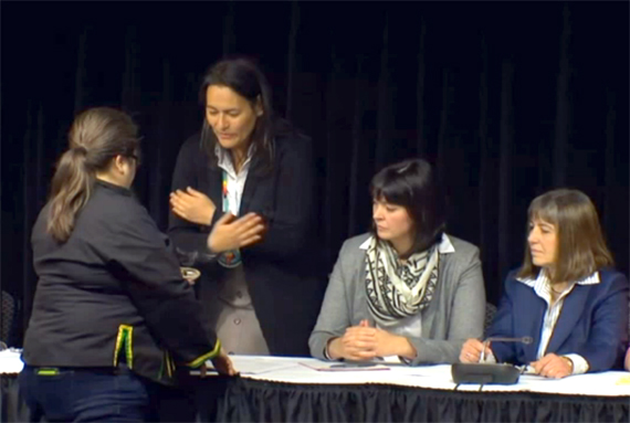 Inquiry commissioner Michèle Audette stands during a smudging ceremony at a commission press conference earlier this year. (CPAC IMAGE)