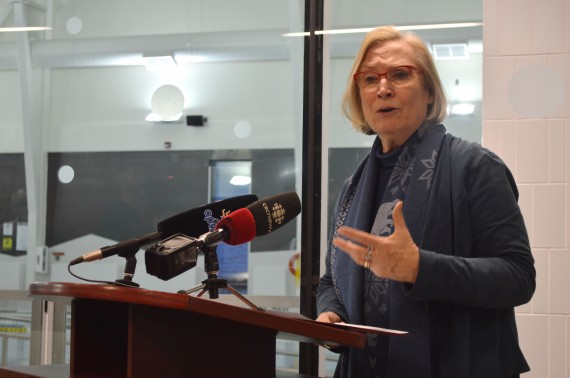 Carolyn Bennett, Canada's minister of Crown-Indigenous relations and northern affairs, speaks at Iqaluit's aquatic centre on Monday, Jan. 15, where she announced that the federal government will pay the costs of hooking up the building up to the city's district heating system. (PHOTO BY STEVE DUCHARME)