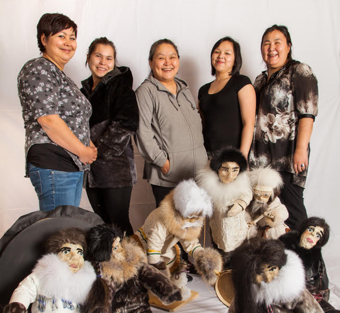 From left to right, workshop participants Amy Hughes, Rachel Hughes, Susanna Barnabas and Candace Barnabas with instructor Vicky Pauloosie Arnauyumayuq and the group's creations. (PHOTO BY CLARE KINES) 