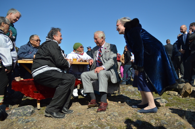 Charles, the Prince of Wales, middle, visits with elders at Sylvia Grinnell Territorial Park June 29 along with then-Nunavut premier, Peter Taptuna, seated left, and Carolyn Bennett, federal minister of Crown-Indigenous Relations and Northern Affairs. (PHOTO BY STEVE DUCHARME)