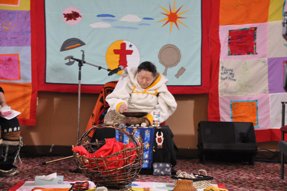 Rankin Inlet elder Monica Uqjuk lit the qulliq Feb. 19, a symbol of light in the darkness. (PHOTO BY SARAH ROGERS)
