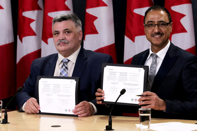 Lorne Kusugak, Nunavut’s minister of community and government services, and Amarjeet Sohi, the federal minister of infrastructure and communities, in Ottawa yesterday. The federal government posted this photo on Twitter to brag about the signing of an Investing in Canada infrastructure agreement between Canada and Nunavut on Wednesday, March 28, worth about $56.6 million a year. (GOVERNMENT OF CANADA/TWITTER)