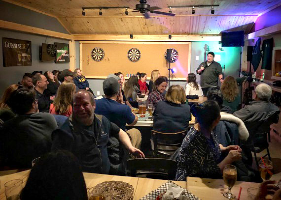 Indigenous comedian Ryan McMahon hosts a comedy night at Kuujjuaq’s Nuna Golf Sports Pub on Thursday, March 8. McMahon, who recently starred in the documentary Colonization Road, was visiting the Nunavik community to work on a video shoot. (PHOTO BY ISABELLE DUBOIS)
