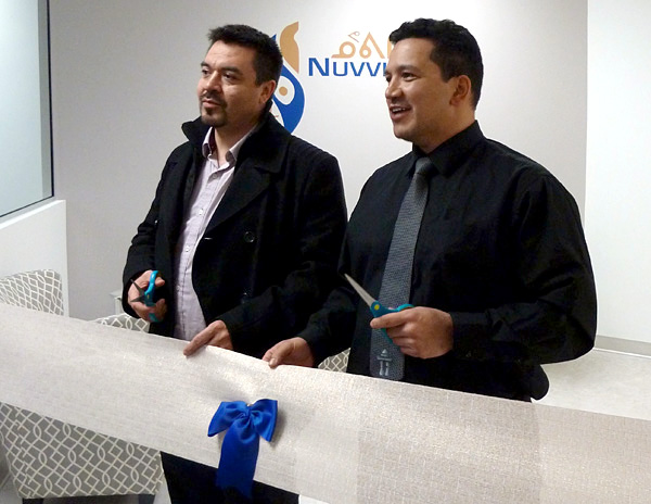 Makivik Corp.Treasurer Andy Pirti, left, and Nuvitti Development Corp. Chair Tommy Palliser cut the ribbon at the opening of Nuvviti's new Montreal office March 14. Nuvviti's new office is located in the borough of Saint Laurent, near Makivik's Montreal office, and is staffed by three people—interim CEO Duncan Dee, interim CFO Eitan Dehitar and officer manager Lynn Moorhouse—with plans to add more staff this year. Makivik launched the arm's-length entity last year to oversee the day-to-day operations of its subsidiaries and its joint ventures. (PHOTO COURTESY OF MAKIVIK)