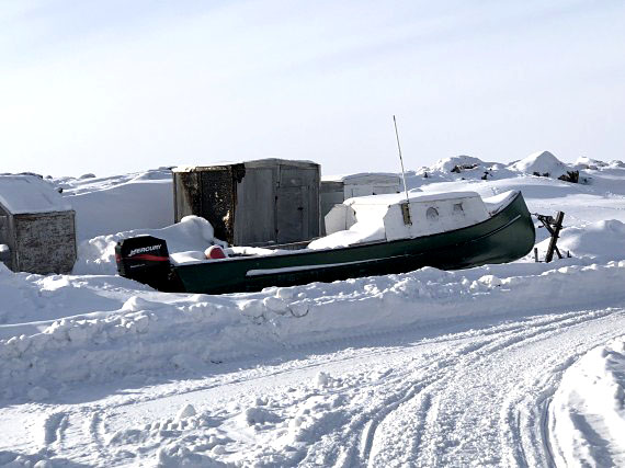 Becalmed not by a lack of wind but by the presence of sea ice, this boat, photographed in Iqaluit on March 14, has some months to wait. (PHOTOGRAPH BY PATRICIA LIGHTFOOT)