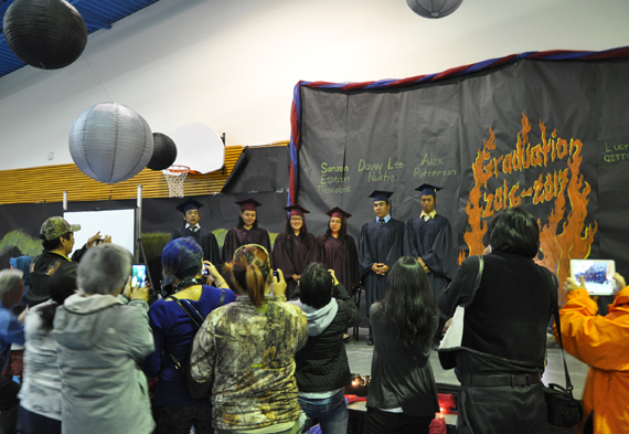 Family and friends take photos of Kiluutaq school’s graduating class of 2016-17 following a May 2017 ceremony in Umiujaq. (FILE PHOTO)