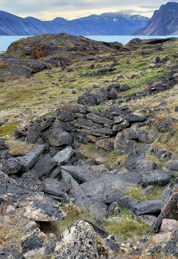 Maggie Kuniliusie came across the ancient, untouched remains of  Thule sod houses and food caches during a family day trip to Mattaatujjanaq, a traditional name meaning a place of abundant of whale skin, also known as Matak Fiord, in Auyuittuq National Park south of Qikiqtarjuaq, Nunavut. Nunatsiaq News wishes our readers a restful August long weekend. Our offices in Iqaluit and Ottawa will be shut on Monday. We’ll be back at it on Tuesday, Aug. 7. (PHOTO COURTESY OF MAGGIE KUNILIUSIE)