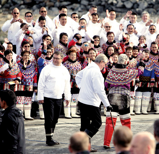 The prime minister of Denmark, Lars Løkke Rasmussen, Thor Pedersen, Speaker of the Danish Parliament, and Kuupik Kleist, who then served as Greenland's prime minister, are seen at a celebration in Nuuk held June 21, 2009, for what was then Greenland's new self-governance law. The island country still seeks full independence from Denmark. (FILE PHOTO)