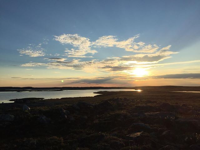 Tiffany Aupilardjuk watched the sky grow dark at Supluraujaq, outside of Rankin Inlet, July 25. Night has returned to many communities in Nunavut. (PHOTO BY T. AUPILARDJUK)