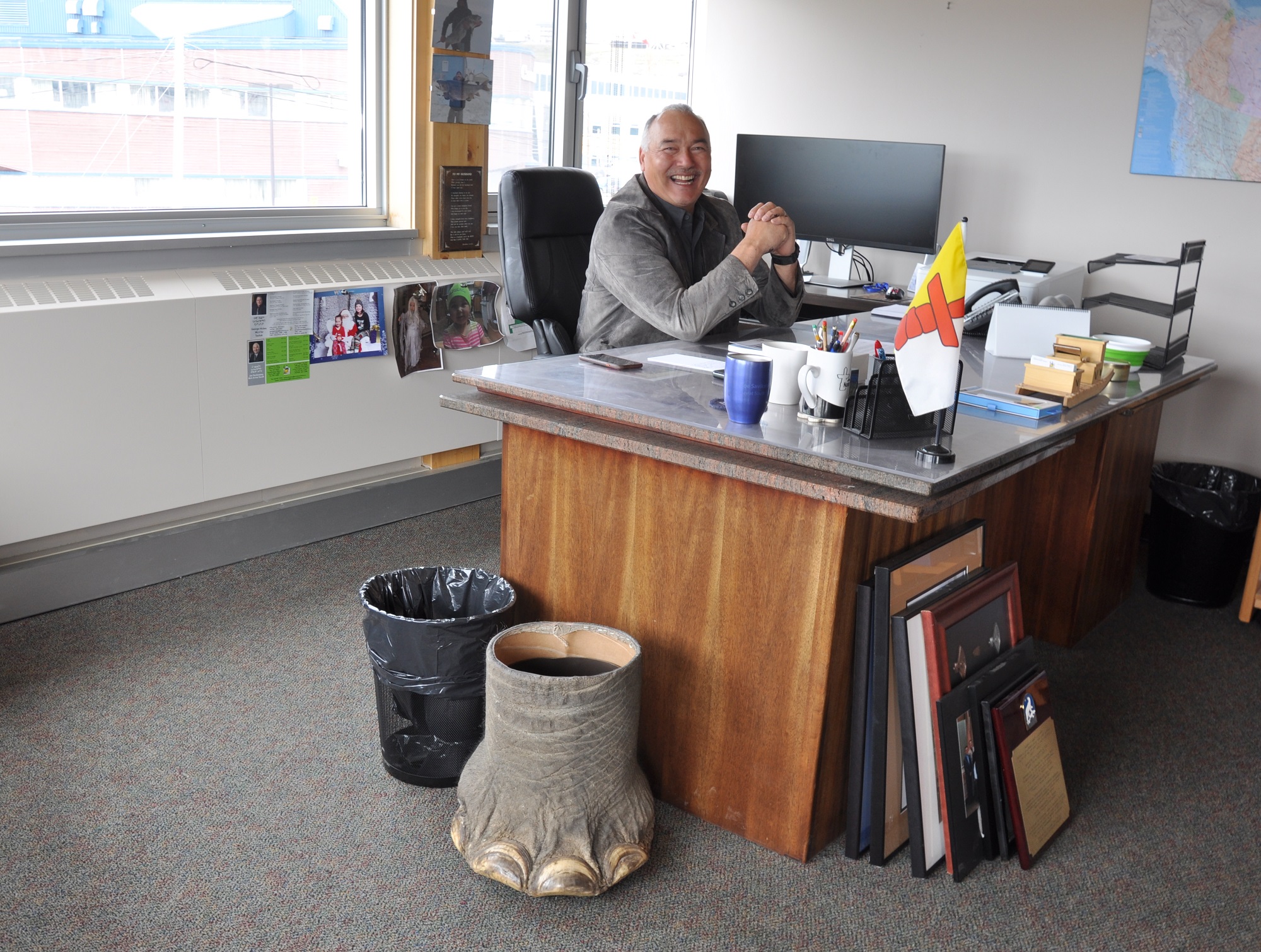 Nunavut Premier Joe Savikataaq sits at his desk in his office on the top floor of the legislative assembly building in Iqaluit. Next to his desk sits one of his hunting trophies, a wastebasket made from an elephant hunted by his son, Joe Jr., on a hunting safari the pair went on in Zimbabwe. (PHOTO BY SARAH ROGERS)