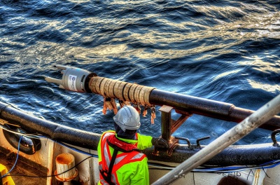 IT Telecom crew members prepare to launch what's called the Gravity Corer off its vessel; the tool is used to collect seabed core samples. (PHOTO COURTESY OF IT TELECOM)