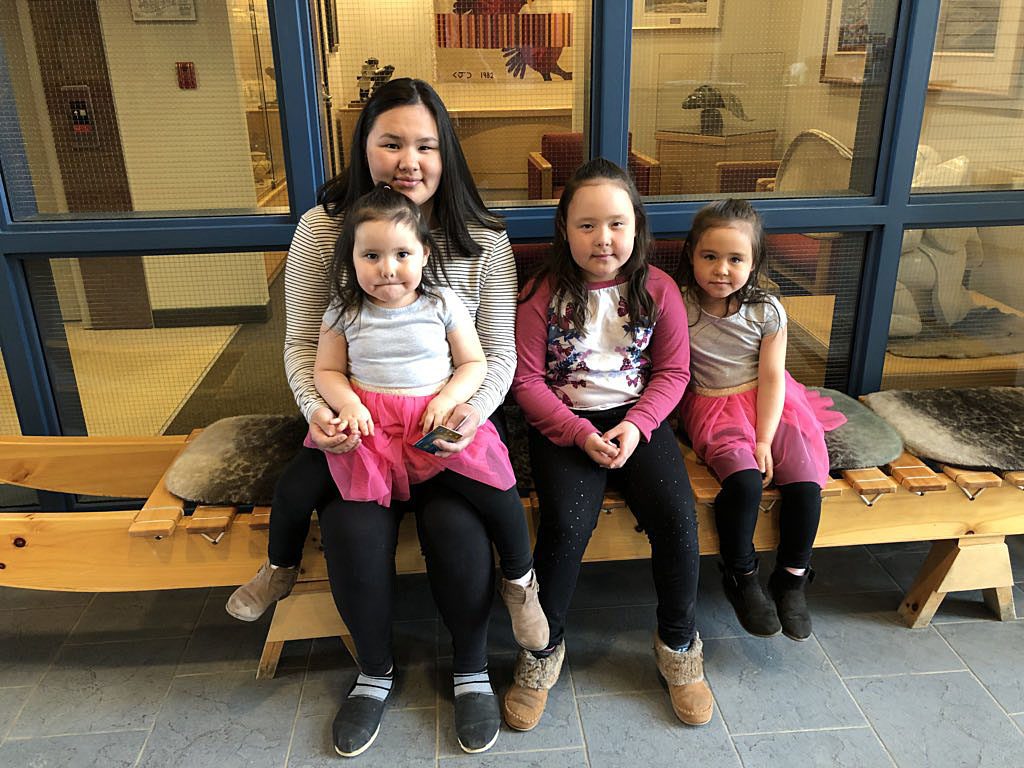 The daughters of Kugluktuk MLA Mila Kamingoak visit their mom at work in the legislative assembly this past June 13. Speaker Joe Enook has named members to a commission that will look at how to make MLAs' pay packages more family-friendly. (FILE PHOTO)