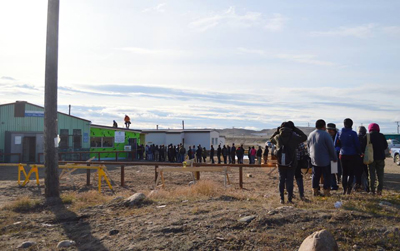 Iqaluit residents line up at the city’s cold beer and wine store, which opened one year ago on Sept. 6. The Government of Nunavut is looking for feedback from the public on the pilot project. An online survey is available until Sept. 28 and a paper survey can also be filled out in person at the store. (FILE PHOTO)