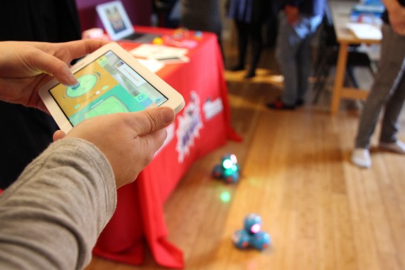 Courtney Schreiter of Canada Learning Code, a group that promotes education in computer programming, uses a tablet as the remote control for light-up robots. (PHOTO BY BETH BROWN)
