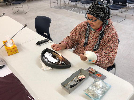 The Kitikmeot Inuit Association’s annual meeting opened this morning in Cambridge Bay, Nunavut, with a prayer and the lighting of a qulliq by Eva Kakolak Avadluk. The meeting continues until Thursday evening and will include the signing of a benefits agreement with Sabina Gold and Silver Corp. for its gold mine project. (PHOTO BY JANE GEORGE)