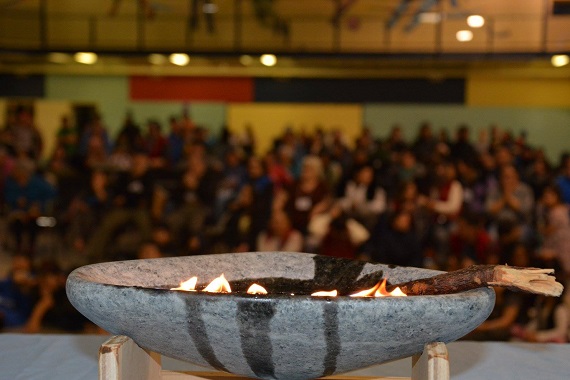 Organizers light a qulliq Oct. 21 at the opening ceremony for Puttautiit 2018, Nunavik's fourth annual suicide prevention conference, which is being held in Kangiqsujuaq this year. This year’s conference theme is Generations Standing Together. The event will address the impacts of trauma, grieving and healing and the Inuit cultural identity. (PHOTO COURTESY OF NRBHSS)