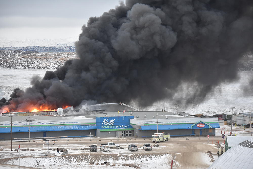 Black smoke billows from Iqaluit's Northmart around 8 a.m. on Thursday, Nov. 8. (PHOTO BY COURTNEY EDGAR)