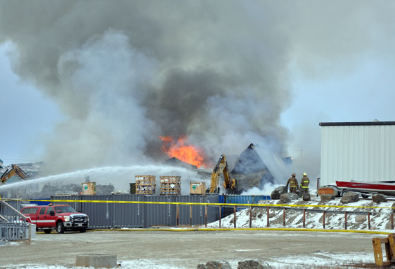 Firefighters said a blaze at Iqaluit's Northmart store had been contained by mid-morning on Thursday, Nov. 8, although the fire appeared to be flaring up again around noon. (PHOTO BY SARAH ROGERS)
