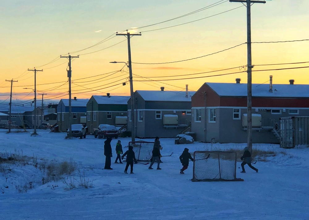 Children play street hockey in Kuujjuaq last Sunday afternoon, just before 3 p.m. as the sun was already setting. (PHOTO BY ISABELLE DUBOIS)