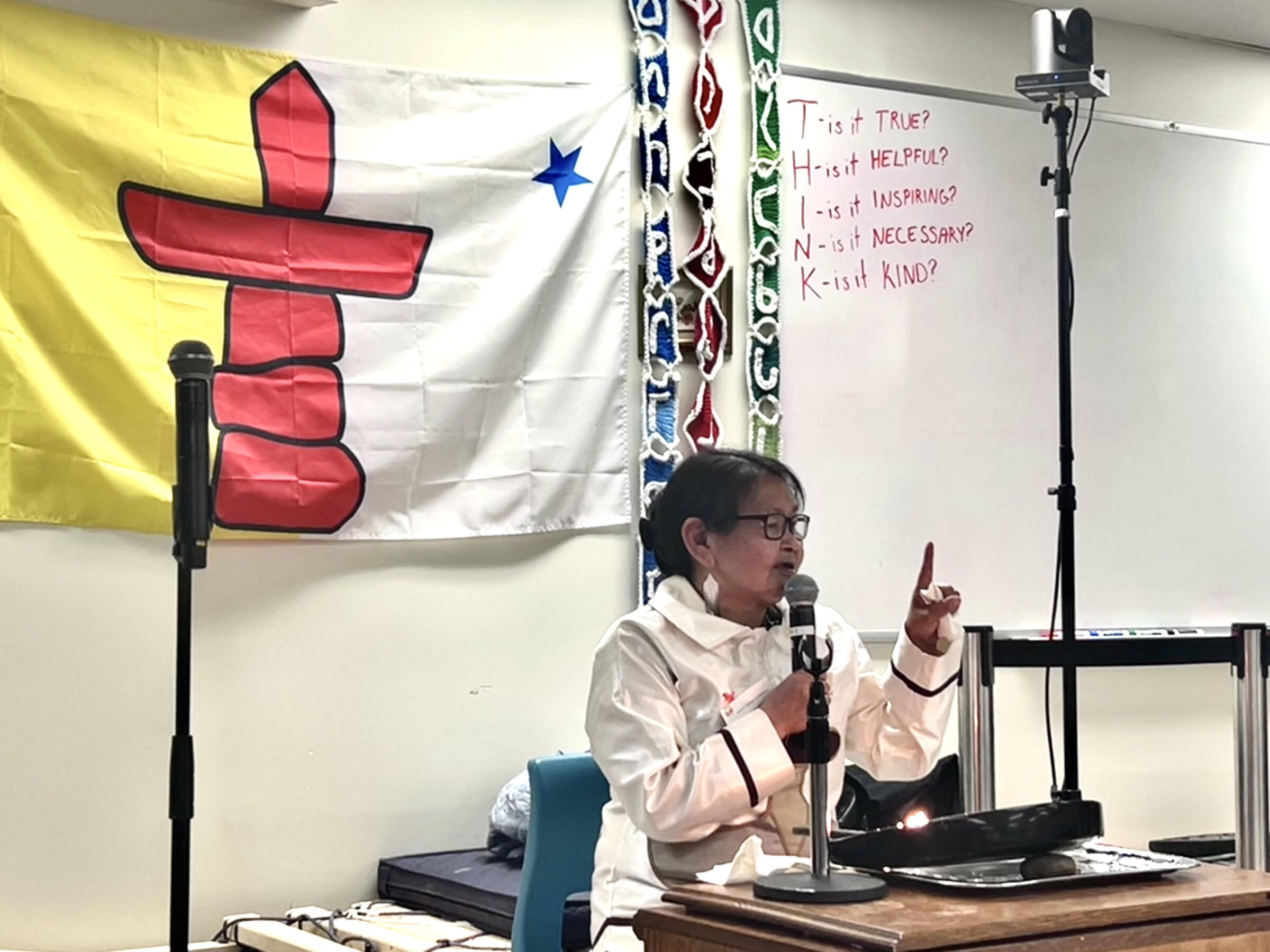 “You will experience hardship in life, that’s manilaaksiuniq, or rough ice,” said Isaruit Arts elder consultant Asenath Kannutaq. She lit the qulliq to start the second day of the Creators’ Conference in Ottawa. She spoke with attendees about being on the ice with her father in Sanirajak, maintaining a qamutiik, navigating blizzards, and giving her pualuuk, or mittens, to her mother to keep her hands warm. (Photo by Nehaa Bimal)