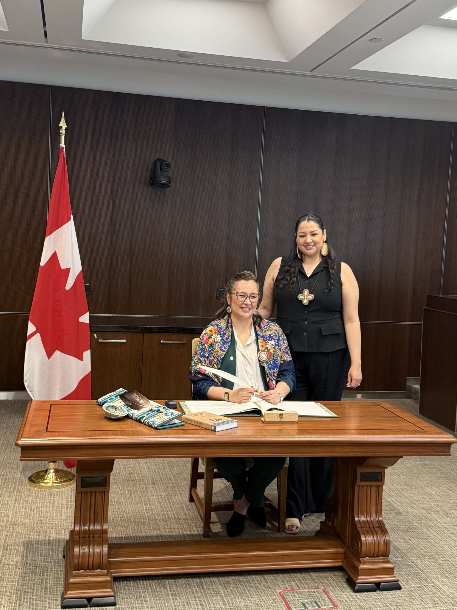 MP Mandy Gull-Masty, seated, shares a smile following her swearing-in ceremony on Sunday. The newly elected representative for Abitibi–Baie-James–Nunavik–Eeyou and Indigenous services minister in Prime Minister Mark Carney’s cabinet took the oath in English, French, and Cree in Ottawa alongside loved ones including her daughter, Esquay Masty. Parliament returned Monday and Gull-Masty is seated in the second row, three seats to the right of Carney. (Photo courtesy of Hannah Wieler)