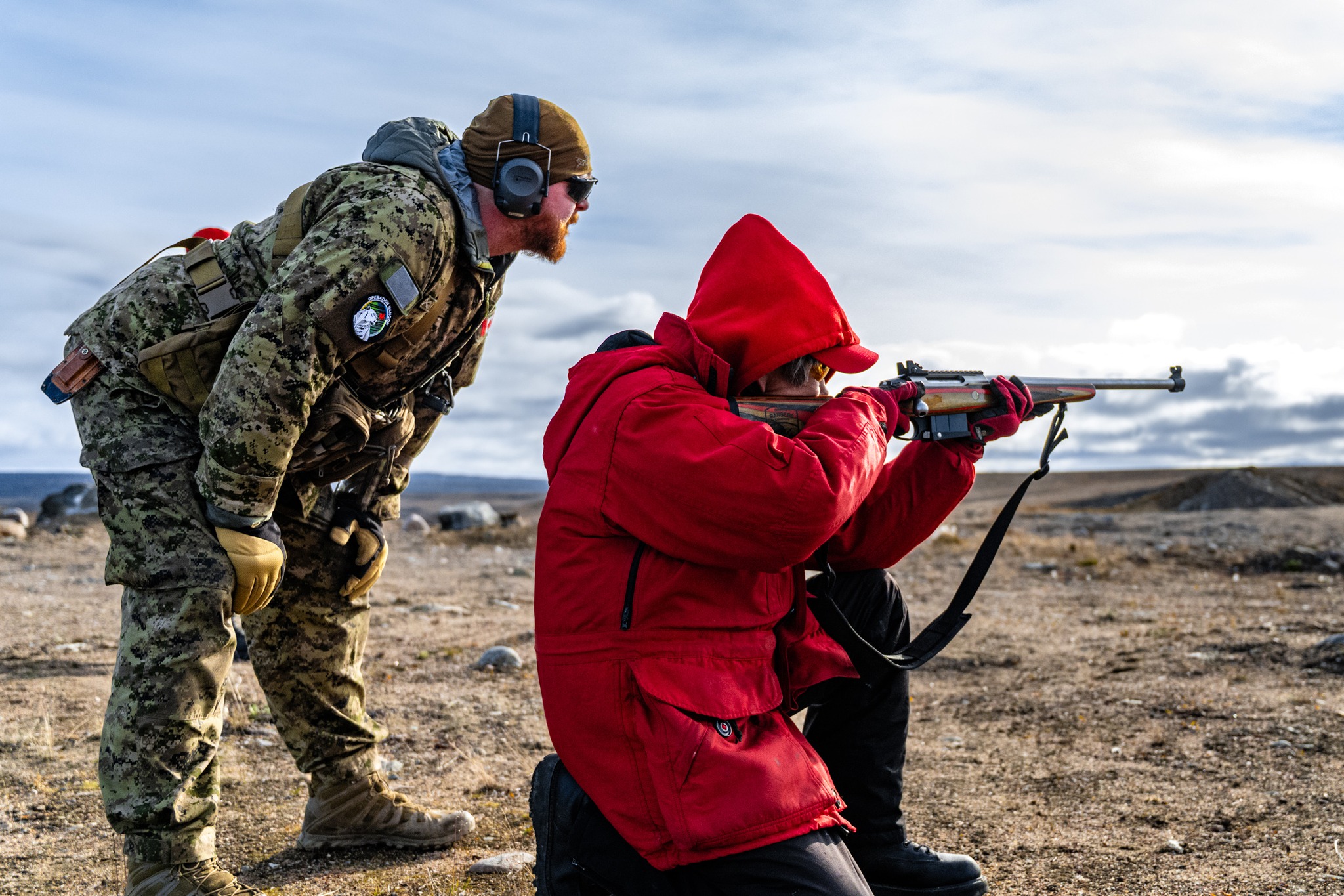 Sgt. Matto Michael, of the 1st Canadian Rangers patrol group, fires a C19 rifle supervised by a member of Land Task Force Nunakput. The training took place on a range during Operation Nanook-Nunakput in Pond Inlet on Tuesday. The domestic security and sovereignty operation involving the Canadian Army, Royal Canadian Navy, Royal Canadian Air Force, Canadian Coast Guard and the Canadian Rangers is being conducted from Aug. 29 to Sept. 14. (Photo courtesy of Master Cpl. Antoine Brochu, Canadian Armed Forces Combat Camera)
