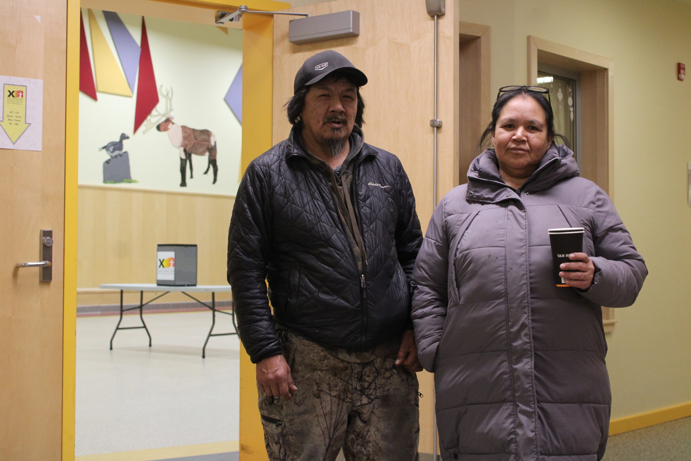 Qikiqtarjuaq Arctic Co-op employees Lasaloosie and Monica Kukseak are among the last people voters in Monday’s Nunavut territorial election at Qikiqtarjuaq’s sole polling station. Voters went to the community hall before it shut down for the day at 7 p.m. In the riding of Uqqummiut the choice is between incumbent Mary Killiktee and challenger Gordon Kautuk. There is no specific issue that’s important to Kukseaks, but they feel like all citizens “must” vote in every election, Monica Kukseak says. (Photo by Arty Sarkisian)