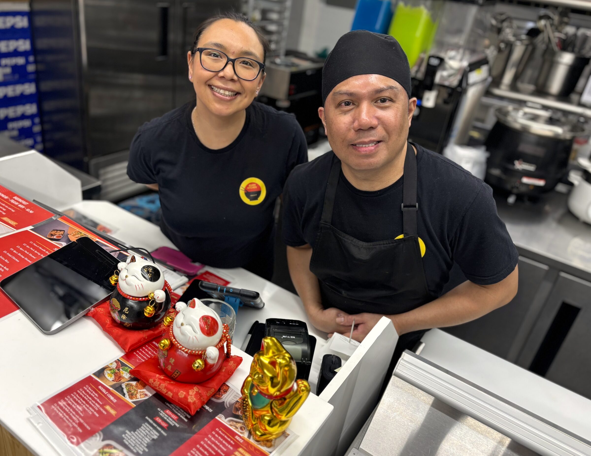 Angela Kownirk, left, and Ramel Amoyo tend the till at Asian Kitchen in Iqaluit on an especially busy Tuesday evening. The restaurant had a 20 per cent bump in business that the pair attributed to the Lunar New Year, otherwise referred to as Chinese New Year. It’s now the Year of the Horse, according to the Chinese zodiac. (Photo by Daron Letts)