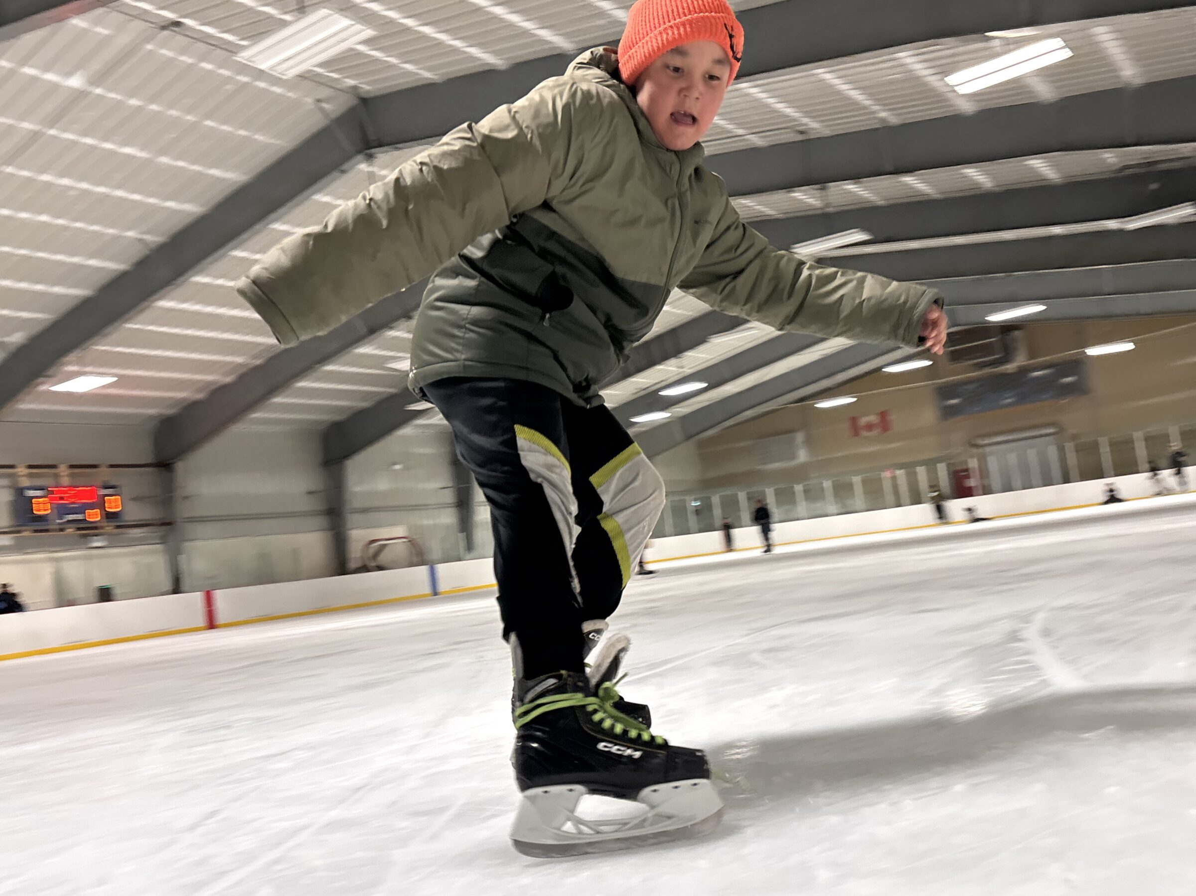 Nazareth Dialla, 9, skids to a stop at Aksayuk Arena in Pangnirtung during a public skate on Sunday afternoon. (Photo by Daron Letts)