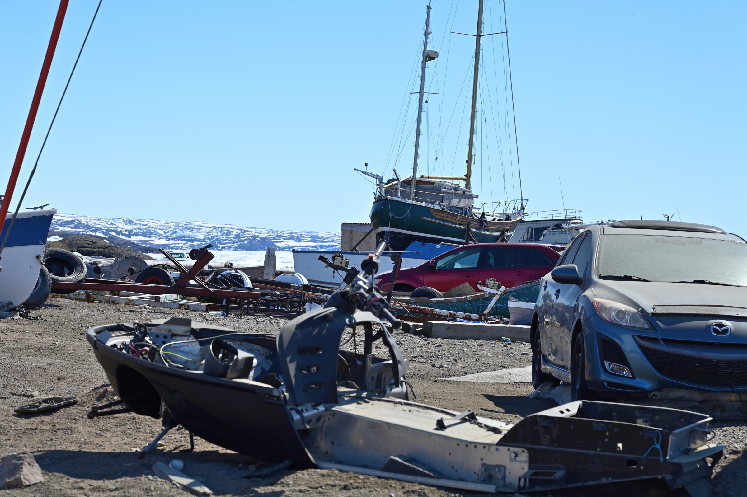 The City of Iqaluit has asked residents to check near the causeway boat launch for derelict vehicles, propane tanks, tires and other debris they may have left there. Operational boats, snowmobiles and qamutiik may remain where they are, but other refuse must be gone by June 12, the city announced Friday in a public service announcement. Residents can contact bylaw to make arrangements for removal of items. (Photo by Mosha Folger)