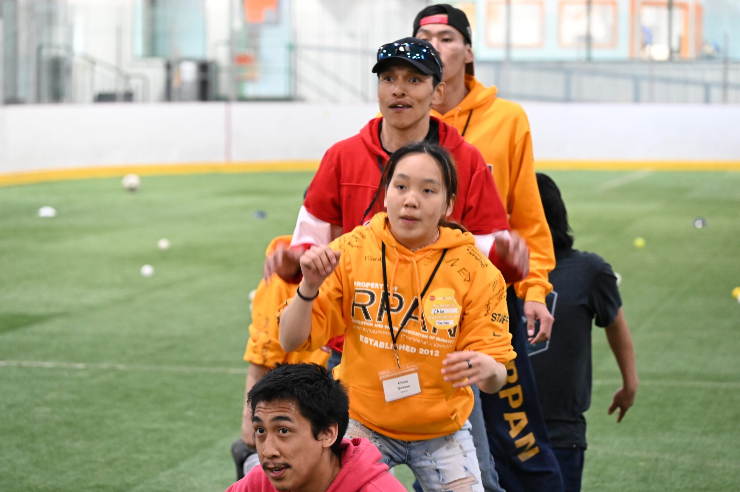 Igloolik camp co-ordinator John Paul Kangok, front, participates in a summer camp training exercise Wednesday at the Arctic Winter Games arena in Iqaluit. He’s one of more than 100 youth and hamlet staff from across Nunavut who are attending the four-day-long training event, run by the Jays Care Foundation in partnership with Recreation and Parks Association of Nunavut. Kangok is pictured, front to back, with RPAN youth leader Chloe Quassa, Kinngait recreation co-ordinator Saagiaq Pudlat and youth leader Ian Iqqaqsaq. (Photo by Mosha Folger)