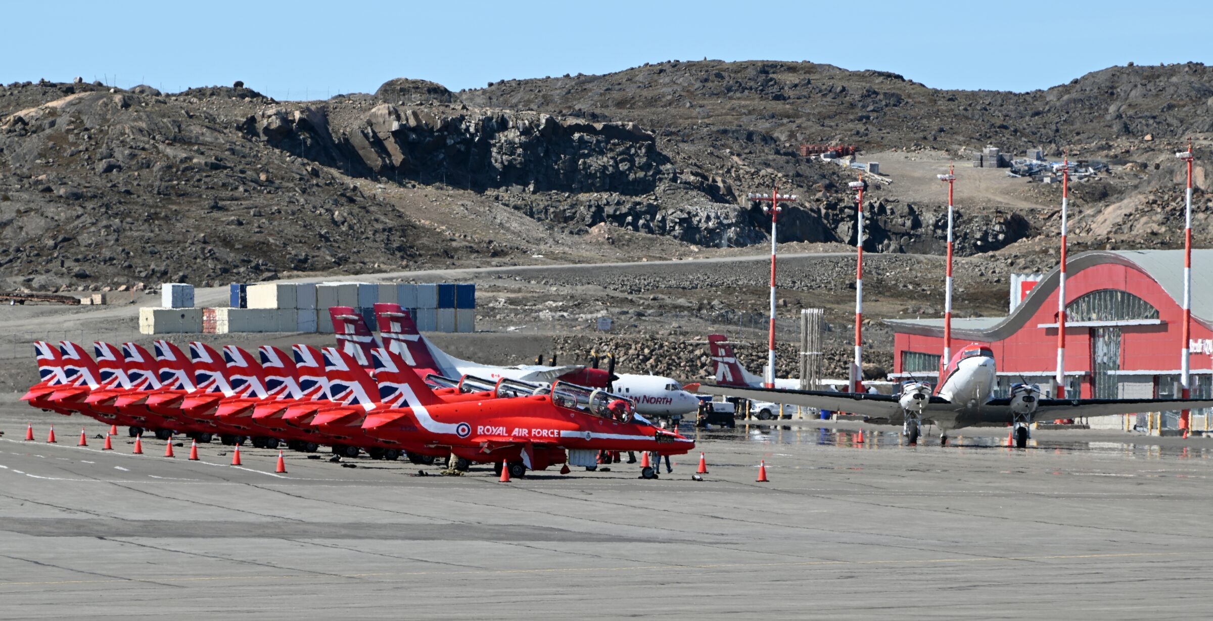 The U.K.’s Royal Air Force Red Arrows sit on the tarmac June 18 at the Iqaluit Airport as the aerobatic display team makes its way to the east coast of the U.S. for six airshows this summer. (Photo by Mosha Folger)