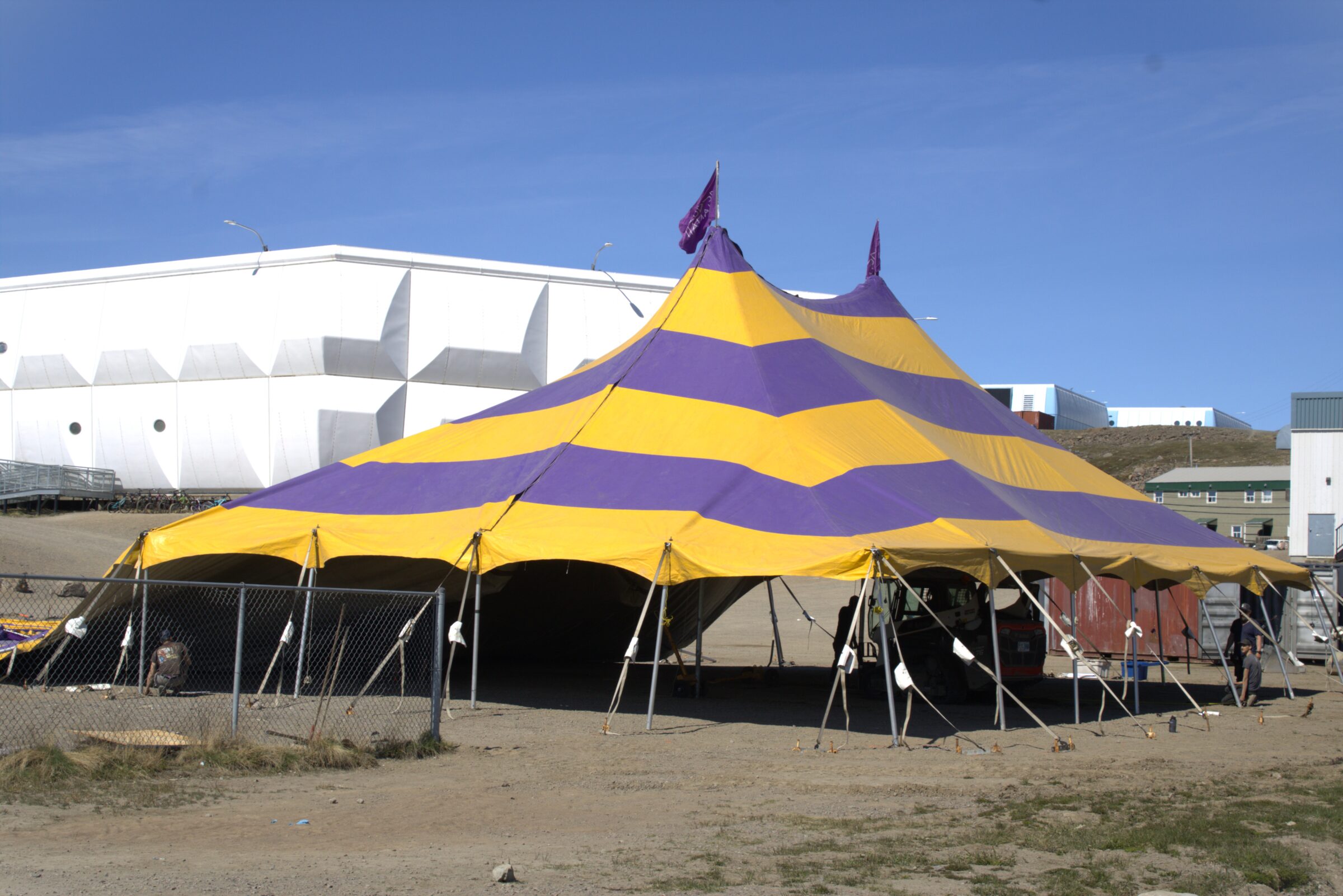 An eight-person crew from Tom Fitzgerald Construction erects the upcoming Alianait Arts Festival’s big top tent in Iqaluit at 2 p.m. on Friday. The festival will take place from June 18-21 and feature such performers as Naja P, a 26-year-old singer-songwriter from Greenland; Beatrice Deer from Quaqtaq; Arviat’s Jacob Okatsiak; and Greenland’s Andachan. (Photo by Daron Letts)