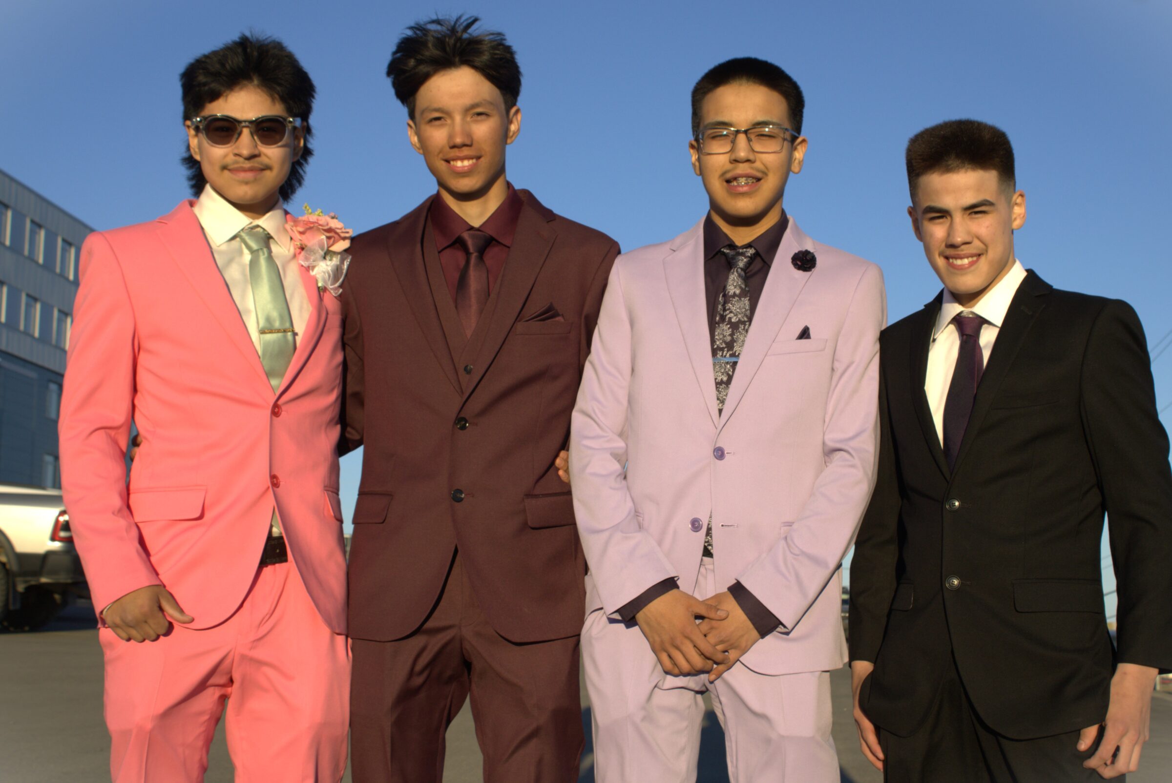 Grade 12 graduates, from left to right, Jason Anilniliak, Duncan Mearns, and Jaxson Gillis, and Grade 10 student Jayden Lewis, are dressed for the Inuksuk High School prom on Saturday night. The dance was held at Aqsarniit Hotel. (Photo by Daron Letts)